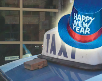 happy new year hat superimposed over a taxi top light